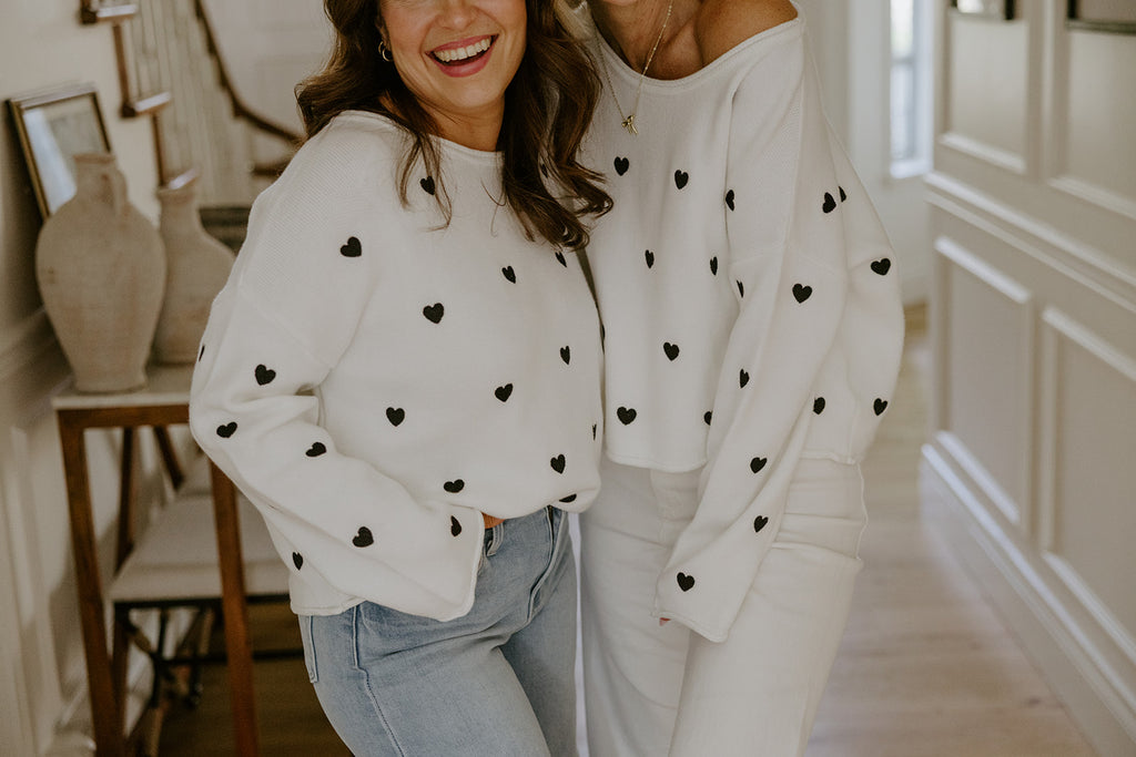 White Sweater with Black Hearts