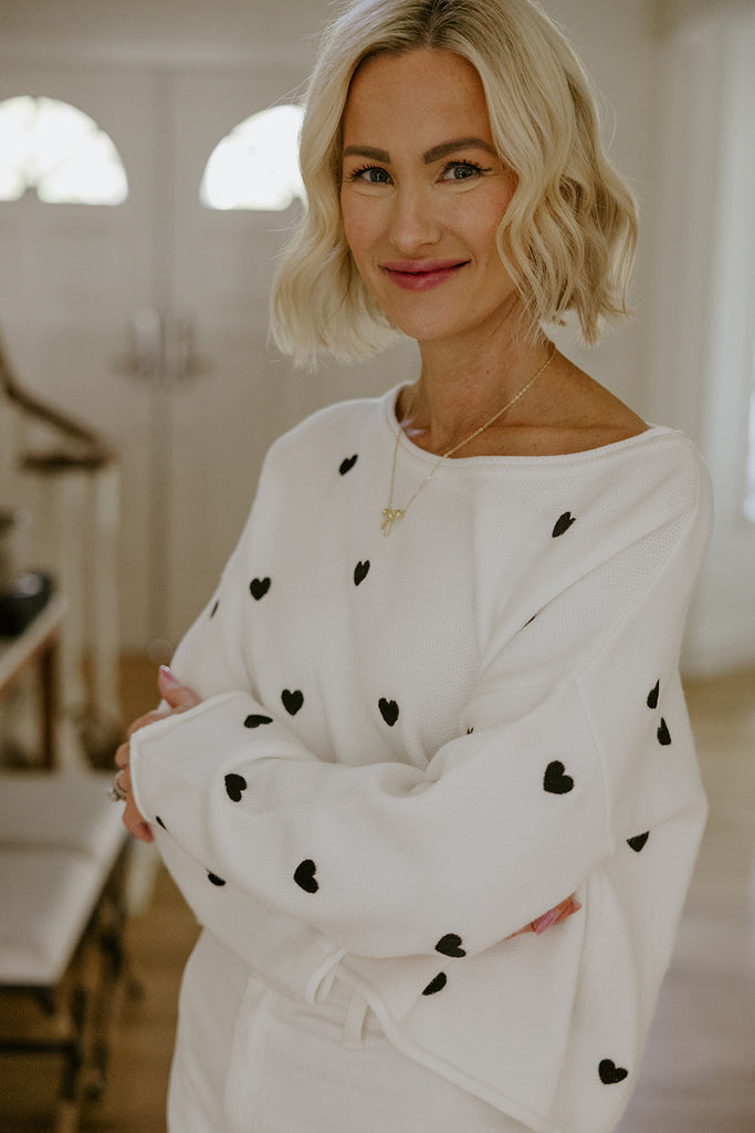 White Sweater with Black Hearts
