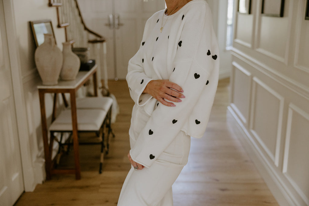 White Sweater with Black Hearts