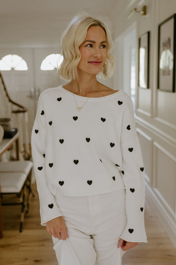 White Sweater with Black Hearts